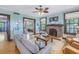 Cozy living room with fireplace and seating area at 516 Gulf Blvd, Indian Rocks Beach, FL 33785