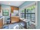Efficient kitchen with wood cabinets and a window overlooking the back at 516 Gulf Blvd, Indian Rocks Beach, FL 33785