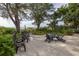 Relaxing patio with ocean views, surrounded by lush landscaping and comfortable seating at 516 Gulf Blvd, Indian Rocks Beach, FL 33785