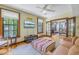 Bright living room features hardwood floors, fireplace, and view into adjacent room at 516 Gulf Blvd, Indian Rocks Beach, FL 33785