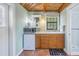 Small kitchenette with microwave, mini-fridge, and sink at 516 Gulf Blvd, Indian Rocks Beach, FL 33785