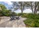 Relaxing patio with ocean views, surrounded by lush landscaping and comfortable seating at 516 Gulf Blvd, Indian Rocks Beach, FL 33785