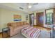 Comfortable den with sofa and colorful artwork at 516 Gulf Blvd, Indian Rocks Beach, FL 33785