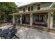 Two story house exterior with a large front porch and patio area at 516 Gulf Blvd, Indian Rocks Beach, FL 33785