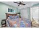 Serene bedroom with a double bed, wooden nightstand and en-suite bathroom at 516 Gulf Blvd, Indian Rocks Beach, FL 33785