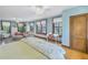 Light and airy bedroom with hardwood floors, a comfortable bed, and natural light at 516 Gulf Blvd, Indian Rocks Beach, FL 33785