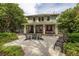Two story house exterior with a large front porch and patio area at 516 Gulf Blvd, Indian Rocks Beach, FL 33785