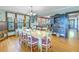 Bright dining room features hardwood floors and built-in hutch at 516 Gulf Blvd, Indian Rocks Beach, FL 33785