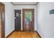 Charming entryway with hardwood floors and antique furniture at 516 Gulf Blvd, Indian Rocks Beach, FL 33785