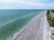 Stunning aerial view of beach and coastline at 516 Gulf Blvd, Indian Rocks Beach, FL 33785