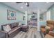 Cozy bedroom with leather sofa, and a view into a separate sleeping area at 516 Gulf Blvd, Indian Rocks Beach, FL 33785