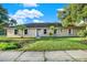 Single-story house with a neatly landscaped yard at 6700 90Th N Ave, Pinellas Park, FL 33782