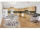 Open kitchen with light wood cabinets and breakfast bar at 6700 90Th N Ave, Pinellas Park, FL 33782