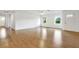 Spacious living room with light laminate flooring and large windows at 6700 90Th N Ave, Pinellas Park, FL 33782