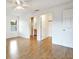 Main bedroom with laminate wood floor, access to bath and walk-in closet at 6700 90Th N Ave, Pinellas Park, FL 33782