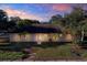 Single story home with a well-maintained lawn and palm trees at 6700 90Th N Ave, Pinellas Park, FL 33782