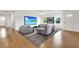 Bright living room with hardwood floors and comfortable seating at 6700 90Th N Ave, Pinellas Park, FL 33782