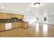 U-shaped kitchen with light wood cabinets and laminate flooring at 6700 90Th N Ave, Pinellas Park, FL 33782
