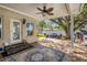 Covered patio with seating area overlooking backyard at 1900 62Nd Ne Ave, St Petersburg, FL 33702