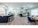 Open living space with kitchen island, hardwood floors, and ceiling fan at 83 Palm Blvd, Dunedin, FL 34698