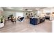 Open concept living room and kitchen with hardwood floors at 83 Palm Blvd, Dunedin, FL 34698