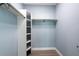 Spacious closet with built-in shelves and hanging rods at 83 Palm Blvd, Dunedin, FL 34698