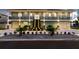 Two-story house with lighted staircase and landscaping at 83 Palm Blvd, Dunedin, FL 34698