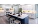 Modern kitchen with a large island and stainless steel appliances at 83 Palm Blvd, Dunedin, FL 34698