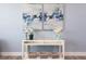 White console table with artwork and decorative accents at 83 Palm Blvd, Dunedin, FL 34698