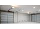 Bright and clean two-car garage featuring high ceilings at 83 Palm Blvd, Dunedin, FL 34698