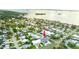 Property's aerial view highlighting waterfront proximity at 83 Palm Blvd, Dunedin, FL 34698
