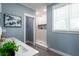 Walk-in shower with white tile and stone accent wall at 83 Palm Blvd, Dunedin, FL 34698