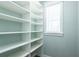 Spacious pantry with ample shelving for storage at 83 Palm Blvd, Dunedin, FL 34698