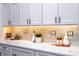 White cabinets and quartz countertops in kitchen at 83 Palm Blvd, Dunedin, FL 34698