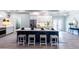 Modern kitchen with a large island and stainless steel appliances at 83 Palm Blvd, Dunedin, FL 34698