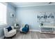 Relaxing sitting area featuring two armchairs and a console table at 83 Palm Blvd, Dunedin, FL 34698