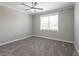 Spacious bedroom with gray carpet and ceiling fan at 83 Palm Blvd, Dunedin, FL 34698