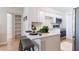 Updated kitchen featuring white cabinets and a breakfast bar at 4000 7Th N Ave, St Petersburg, FL 33713