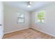 Spacious bedroom with light walls, wood flooring, and ceiling fan at 4000 7Th N Ave, St Petersburg, FL 33713