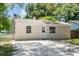 Charming light beige house with white trim and a spacious driveway at 4000 7Th N Ave, St Petersburg, FL 33713