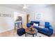 Open living room with a blue sofa and kitchen bar at 4000 7Th N Ave, St Petersburg, FL 33713