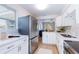 Modern kitchen with stainless steel appliances and an open view to the living room at 4000 7Th N Ave, St Petersburg, FL 33713