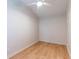 Simple bedroom with light walls, wood flooring, and ceiling fan at 4000 7Th N Ave, St Petersburg, FL 33713