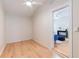 Bright bedroom with wood flooring, ceiling fan and view of living area at 4000 7Th N Ave, St Petersburg, FL 33713