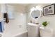 Clean bathroom with white tile, a vanity, and a tub shower combo at 4000 7Th N Ave, St Petersburg, FL 33713