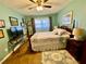 Bright bedroom with wood floors and a comfortable bed at 1701 Pinehurst Rd # 14B, Dunedin, FL 34698