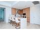 Modern kitchen with light wood cabinets and a large island with seating at 5120 Marina Way # 3303, Tampa, FL 33611