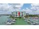 Condo building near marina, showcasing water access at 9525 Blind Pass Rd # 505, St Pete Beach, FL 33706