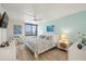 Spacious bedroom with water views and a king-size bed at 9525 Blind Pass Rd # 505, St Pete Beach, FL 33706