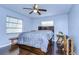 Cozy bedroom with wood floors, double bed, and window with blinds at 2020 58Th S St, Gulfport, FL 33707